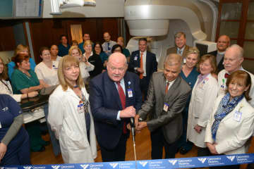 Greenwich Hospital President Norman G. Roth (left) and Ashwatha Narayana, MD, cut the ribbon during a ceremony to unveil the new TrueBeam radiation therapy system, which offers advanced speed and accuracy to treat cancer anywhere in the body.