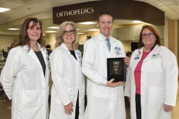 Nancy Barrett-Fajardo, director of Medical/Surgical Services; Bettyann Kempin, assistant VP of Medical/Surgical Services; Nurse Leader Award recipient Derrick Lieb and Ann Marie Leichman, senior VP of Patient Care Services and Chief Nursing Officer.