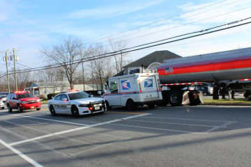 Traffic was able to proceed at a reduced speed following a crash between a tanker and a car.
