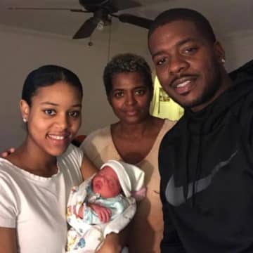 Bernice Horne of Teaneck holds baby Idan with husband Dwight Horne and mother-in-law Claudette Lindsey.