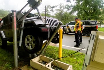 Bollards planted around a roadway electrical box did their job during an early morning crash in Ridgewood on Wednesday, Sept. 13.