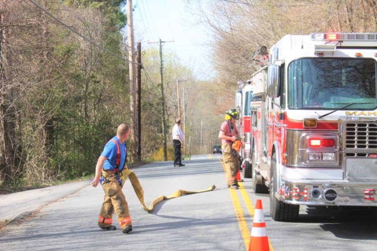 Mahopac firefighters battle a brush fire.