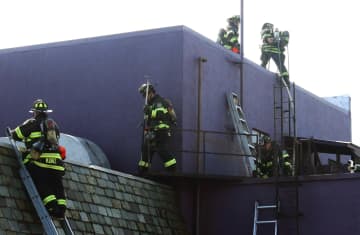 Hackensack firefighters at the Crow's Nest off Routes 17 and 80 on Saturday, March 18.