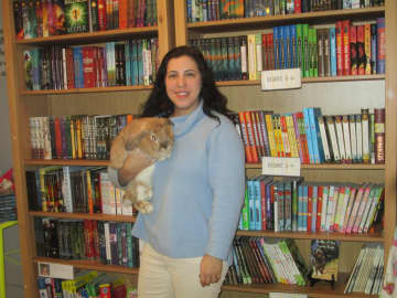 Laura Schaefer, owner of Scattered Books in Chappaqua, with her pet rabbit.