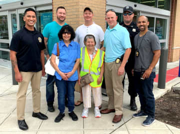 (l. to r.): With Patty and her sister, Susie, are Teaneck Police Detectives Michael Sunga and Ronald Boswell, Officer James Hoover, Detective Lt. Seth Kriegel, Officer Craig Luebeck and Detective Sgt. Michael Moliere