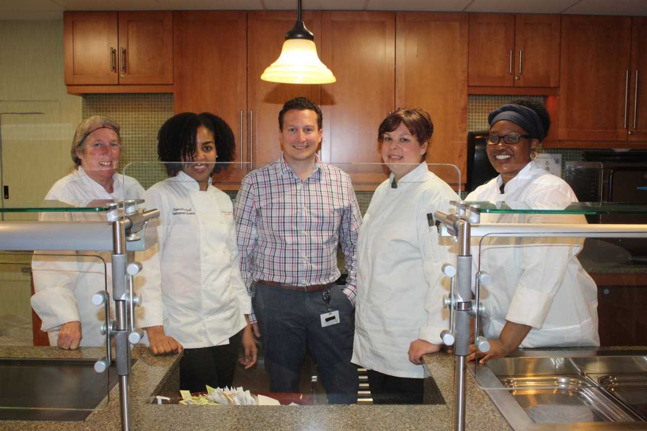 From left: Terri, Sashawna, Anthony, Jennifer and Alicia, in Waveny's kitchen, getting ready to prep a meal.