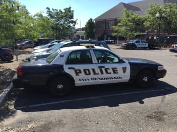 <p>Norwalk police rescued a dog from an overheating parked car Wednesday.</p>