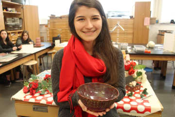 Hannah Ziegler, a senior at John Jay High School, with her ceramics work.