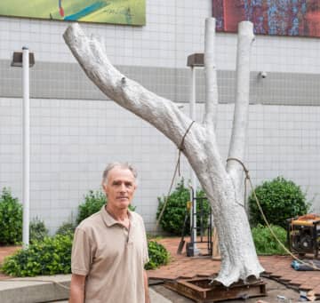Artist Robert Lobe with his latest art installation "X-Ray" outside the New Rochelle Public Library.
