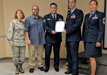 U.S. Air Force Technical Sgt. James P. Connors of New Milford  (center).