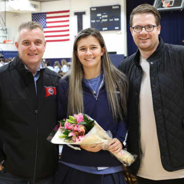 <p>Kristen Roessler, center, a senior at Immaculate High School, was selected to the 2017 Fall High School Girls All-America Team by United Soccer Coaches. She is pictured with Nelson Mingachos, left, and Brad Jeeves, right.</p>