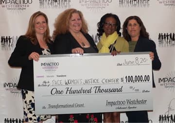 Members of Pace Women’s Justice Center receive their grant from Impact100 Westchester.