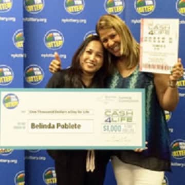 Rockland resident Belinda Poblete, left, poses with lottery personality Yolanda Vega after winning the CASH4LIFE jackpot last spring. Poblete is planning to invest some of her millions in a yogurt and juice bar cafe in Nanuet.