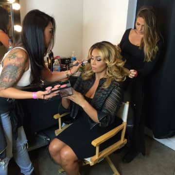 Rebecca Martin, a freelance makeup artist who grew up in Ringwood and now lives in Fair Lawn, puts makeup on Somaya Reece for the filming of Bravo TV’s new reality show, First Family of Hip Hop.