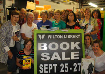 Wilton Library volunteers prepare for the fall fundraiser book sale Sept. 25-27.