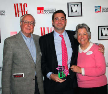 Shown from left are Edward Mundy, award recipient, Nat Mundy and Sarah Mundy.