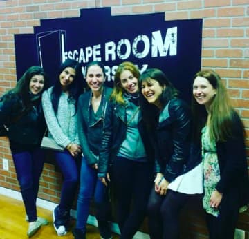 Escape Room NJ team members smile because they made it out.