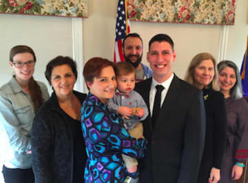 Matthew Blank was sworn in Thursday as a New Canaan Police Officer. From left: sister-in-law, Sarah Sherwood; mother-in-law Jami Sherwood; wife, Lauren and son Jackson, Blank; brother-in-law Robbie Sherwood; mother Bonnie and sister Samantha Blank.
