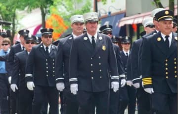 Members of the Hastings-on-Hudson Fire Department marching in the town's 2015 Memorial Day Parade.