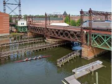 The Walk bridge carries Metro-North and Amtrak trains over the Norwalk River at the mouth of the Norwalk Harbor. It swings open to allow marine traffic to pass through.