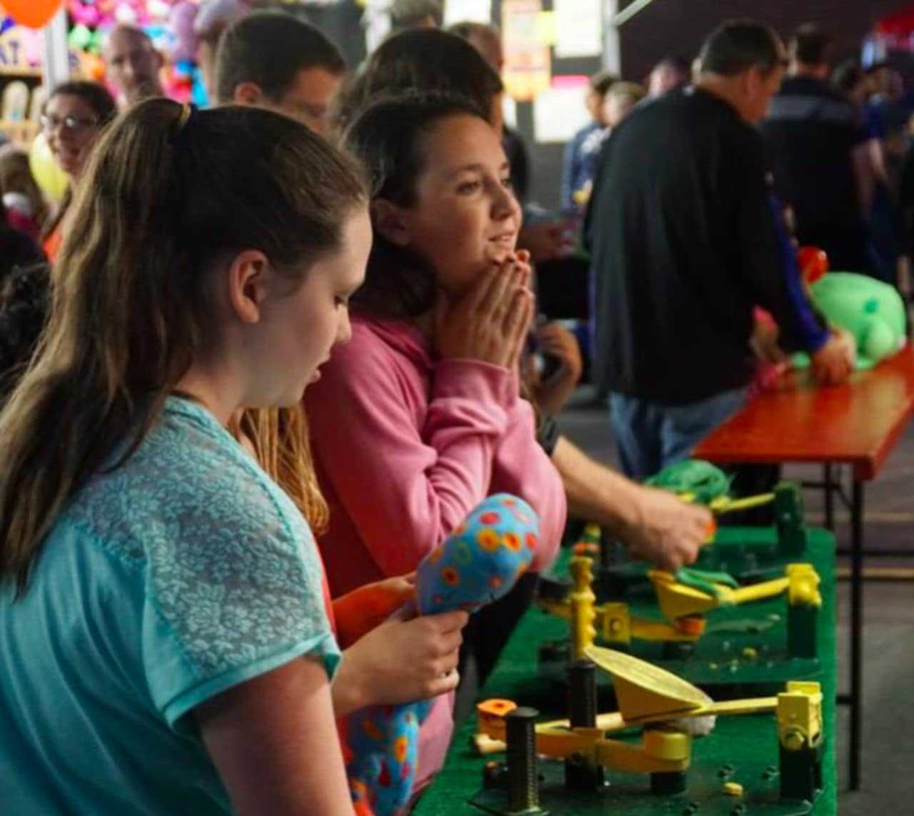 Girls play games at the St. Mary's Carnival in Dumont.