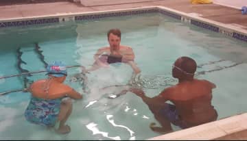 Brookfield resident Joseph Buderwitz teaches a beginning swim class for adults at the Dive Shop.