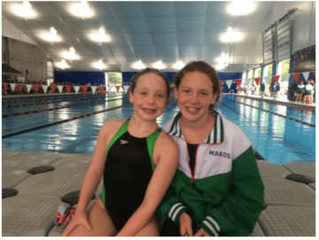 From left, Bethel girls Julia and Olivia Herbert have set up a fundraising page to raise money for their swim team at the Regional YMCA in Brookfield.