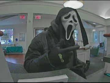 This suspect in  Halloween mask robbed the First County Bank on Main Avenue Tuesday afternoon. The suspect is captured on a bank video surveillance in an image released by Norwalk Police.
