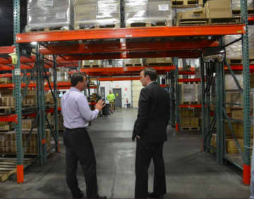 U.S. Sen. Chris Murphy‏ tours the warehouse for Wind Hardware in Newtown on Friday.
