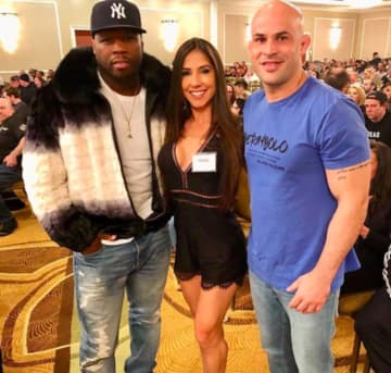 Rapper 50 Cent with Ms Bikini Olympia Angela Teixeira and her husband Marc Teixeira at the Teaneck Marriott Saturday.