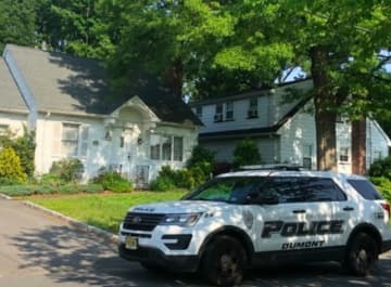 Anita Flaim was found dead in her neighbor's driveway Monday morning.