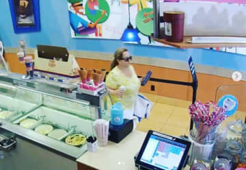 This woman seen on surveillance camera is accused of stealing a purse at Baskin-Robbins in New Canaan, according to police.