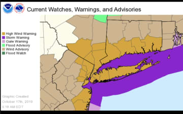 A High Wind Warning is in effect for areas shown in brown.