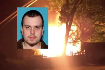 Jonathan Davies, 26, was arrested following an investigation into the early-morning Wednesday blaze, authorities said Thursday.