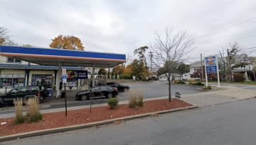 Two men shot at each other at a gas station in Poughkeepsie while numerous people were in the area.
