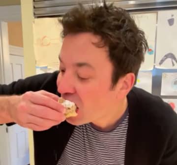 Jimmy Fallon takes a bite of B & W Bakery's famous coffee cake.