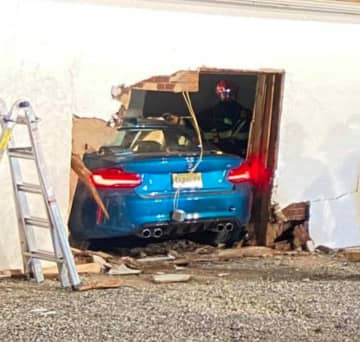Emergency crews were quick to locate and rescue two occupants from a vehicle that slammed into a building in Hunterdon County Sunday night.
