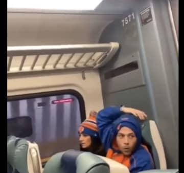 The couple on the LIRR train.