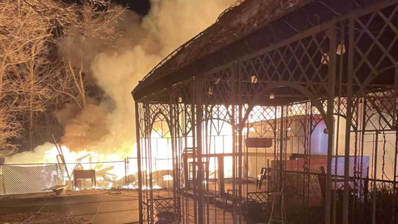 Flames soar from the barn at Kelly's Kids, located in Prospect, CT