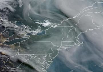 Smoke from Canadian wildfires over Ontario is shown spreading into much of the Northeast and mid-Atlantic on Wednesday, May 10.