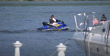 A jet ski rider was killed and another is critical after crashing head-on with another watercraft.