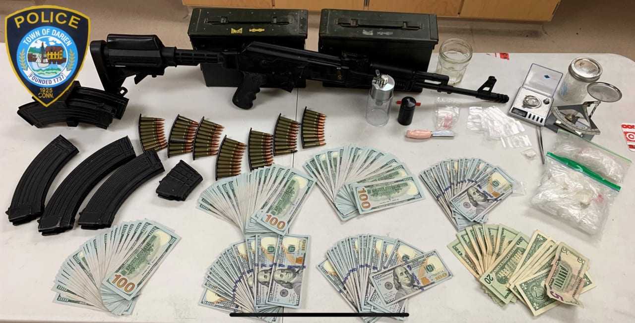 The weapons, drugs and other items seized during the search.
