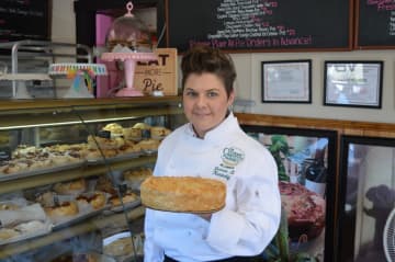 Shannon Cheevers shows off one of her pies.