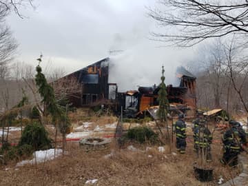 A man suffered burns during a house fire in Lewisboro