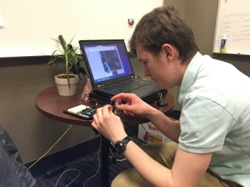 New Canaan High School student Spencer Reeves works on his Arduino robotics project.