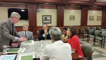 From righ,: Lt. Gov. Kathy Hochul, Sen. Andrea Stewart-Cousins and Tarrytown Mayor Drew Fixell confer at a meeting during their Tarrytown tour on Wednesday.