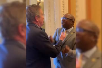 Kentucky Rep. Thomas Massie (left) and New York Rep. Jamaal Bowman argue over gun control in a House hallway on Wednesday, March 29.