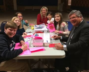 Kids and adults at United Methodist Church of New Canaan make Valentines for seniors during a Sunday School class.