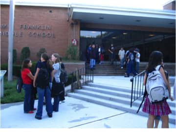 Students heading back into school after their summer vacation at Benjamin Franklin Middle School.