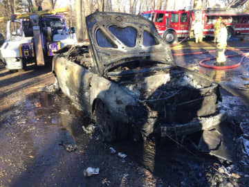 A car was destroyed in a garage fire on Fir Tree Lane in Newtown on Sunday